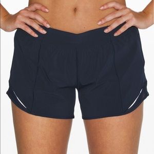 Navy blue hotty hot short. Size 4, 4” inseam.